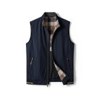 Men's sleeveless zip vest with stand collar, angled zipped pockets and checked lining