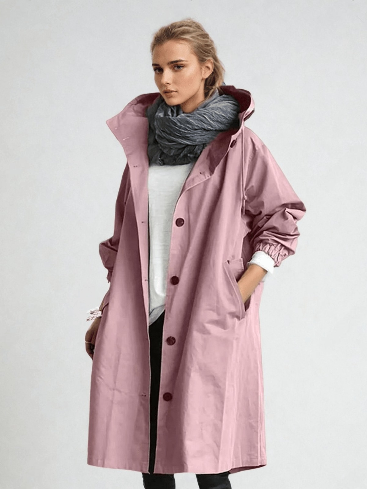 Women's long hooded trench coat with button front and gathered cuffs