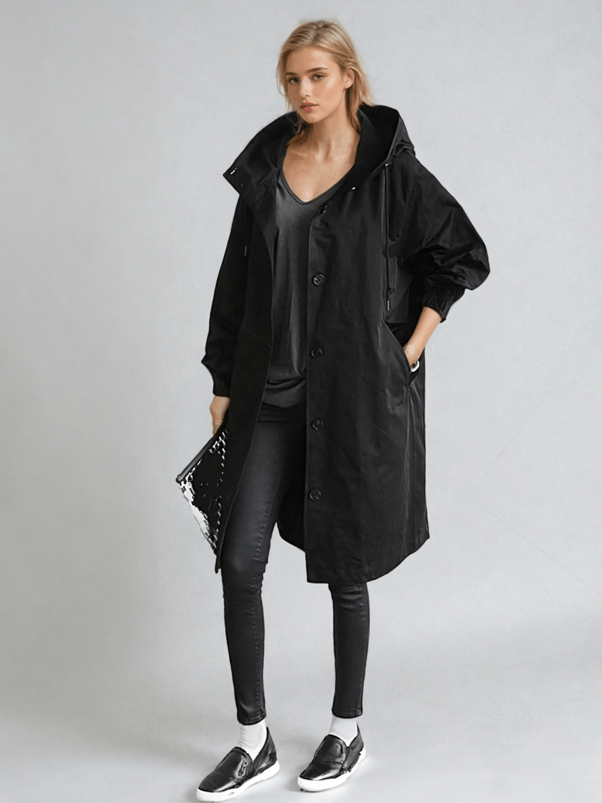 Women's long hooded trench coat with button front and gathered cuffs