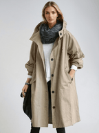 Women's long hooded trench coat with button front and gathered cuffs
