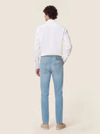 Men's light blue straight leg jeans with five-pocket styling
