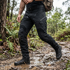 Men's tapered cargo trousers with utility pockets, belt and ankle details