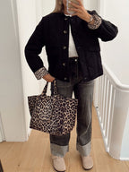 Women's quilted jacket with leopard-print cuffs and button front