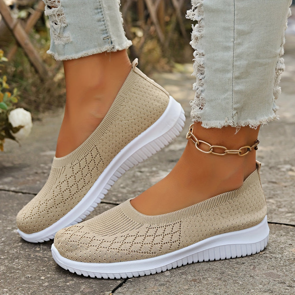 Women's knitted slip-on shoes with closed rounded toe and white ridged sole