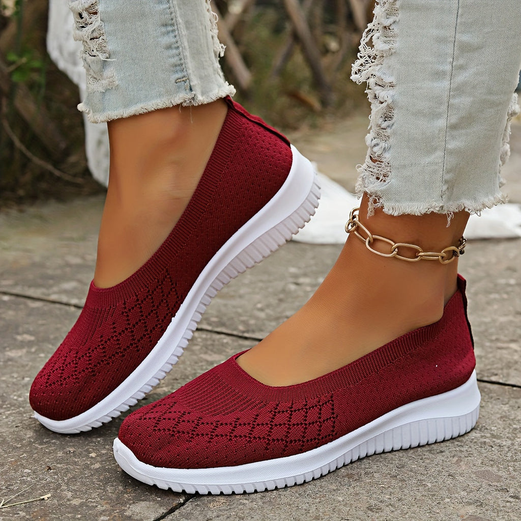 Women's knitted slip-on shoes with closed rounded toe and white ridged sole