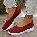 Women's knitted slip-on shoes with closed rounded toe and white ridged sole