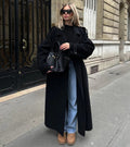 Women's black oversized long coat with lapel collar and button front