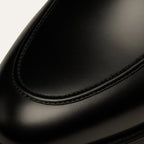 Men's black glossy horsebit loafers with round toe