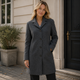 Women's long tailored trench coat with notched lapels, button front and side pockets