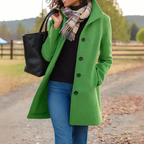 Women's long tailored trench coat with notched lapels, button front and side pockets