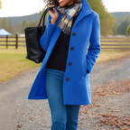 Women's long tailored trench coat with notched lapels, button front and side pockets