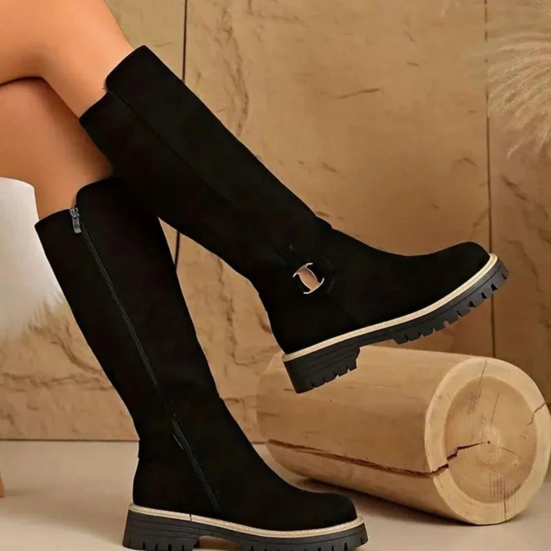 Women's knee-high boots with side zips, buckle details and lugged soles