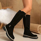 Women's knee-high boots with side zips, buckle details and lugged soles
