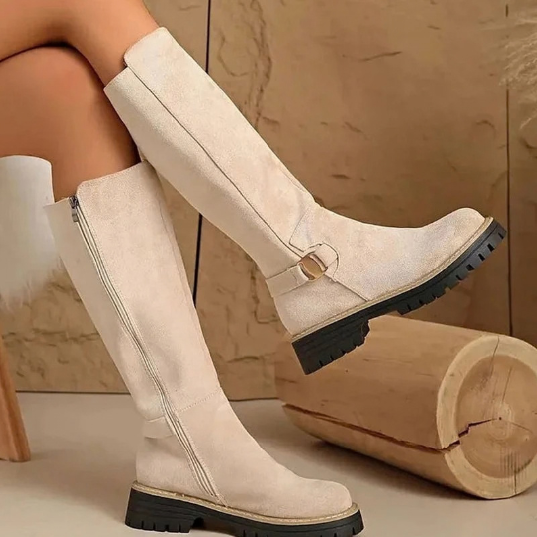 Women's knee-high boots with side zips, buckle details and lugged soles