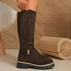 Women's knee-high boots with side zips, buckle details and lugged soles