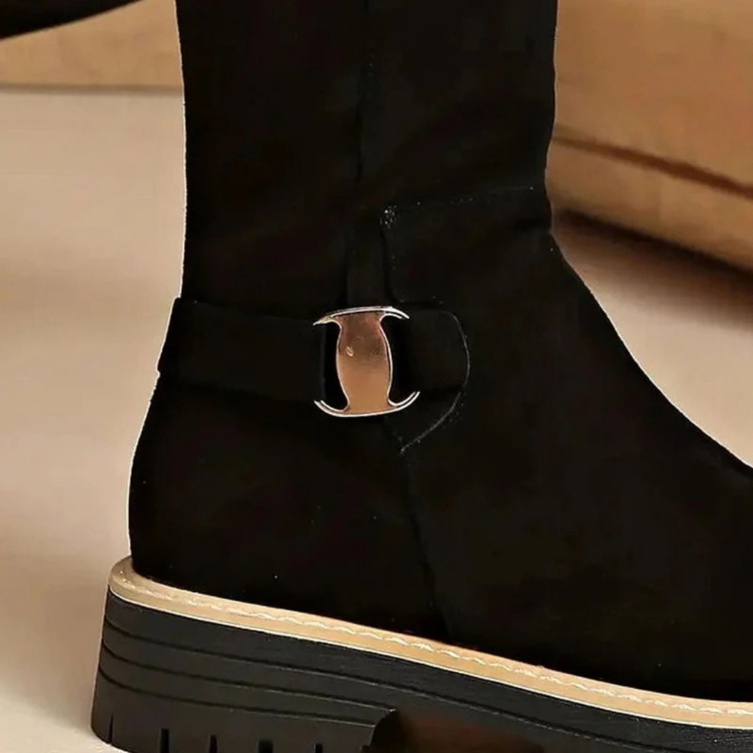 Women's knee-high boots with side zips, buckle details and lugged soles