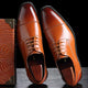 Men's cap toe Oxford dress shoes with lace-up front