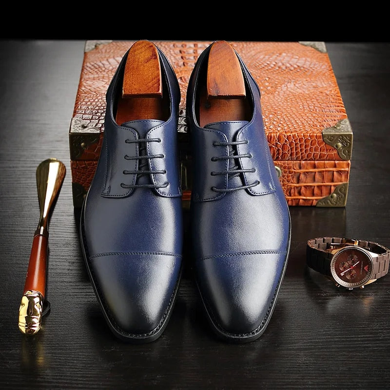 Men's cap toe Oxford dress shoes with lace-up front