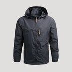 Men's hooded full-zip windbreaker jacket with long sleeves and zipped chest pocket