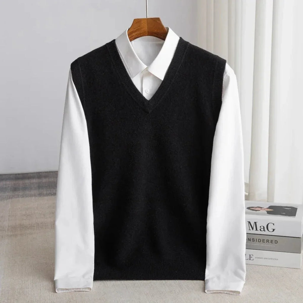 Men's V-neck knitted sweater vest layered over a white shirt