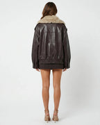 Women's brown cropped jacket with a large beige fur-effect collar and long sleeves