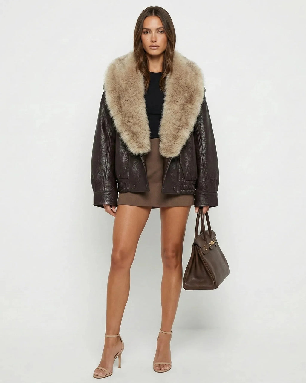 Women's brown cropped jacket with a large beige fur-effect collar and long sleeves