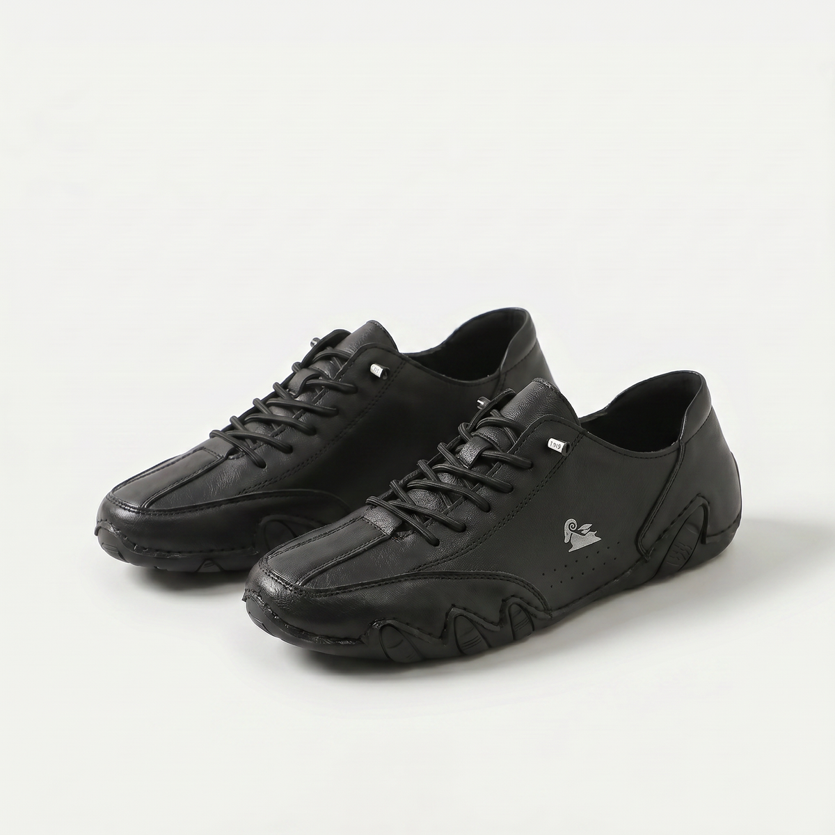 Low-profile lace-up trainers with rounded toes, stitched panels and textured soles