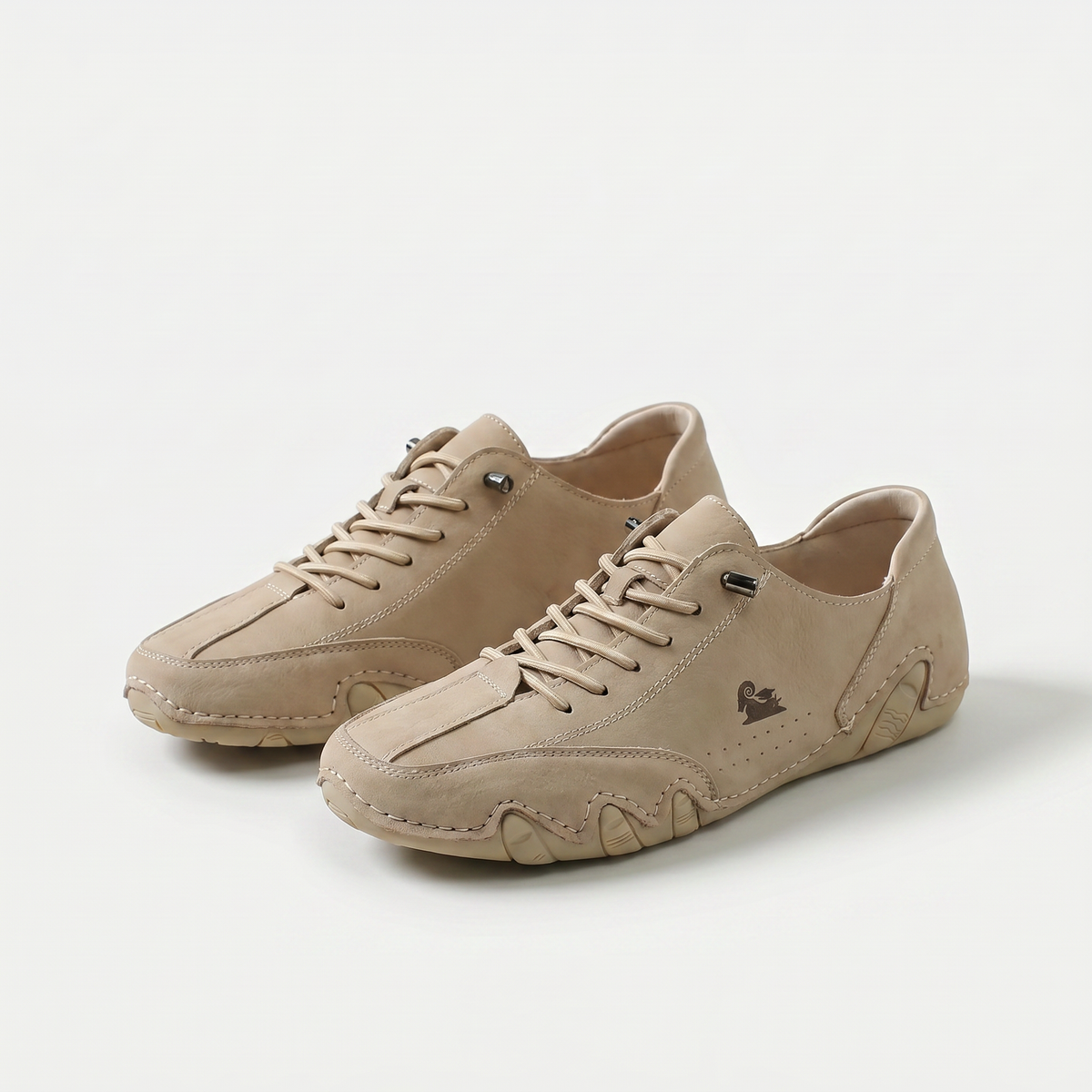 Low-profile lace-up trainers with rounded toes, stitched panels and textured soles
