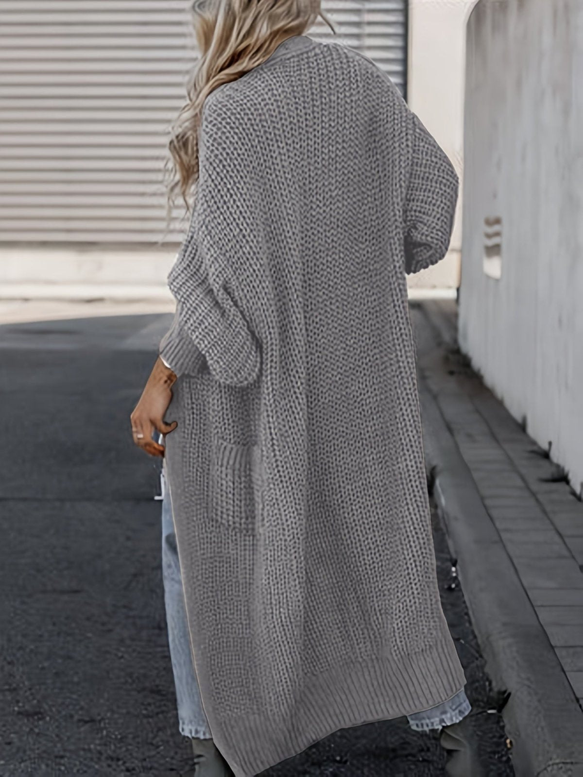 Women's longline open front textured knit cardigan with pockets and balloon sleeves