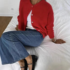 Women's knitted cardigan with round neckline, long sleeves and button front