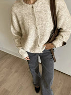 Women's knitted cardigan with round neckline, long sleeves and button front