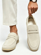 Men's plain penny loafers with moc toe stitching and low heels