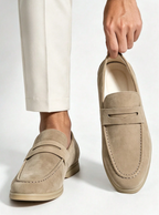 Men's plain penny loafers with moc toe stitching and low heels