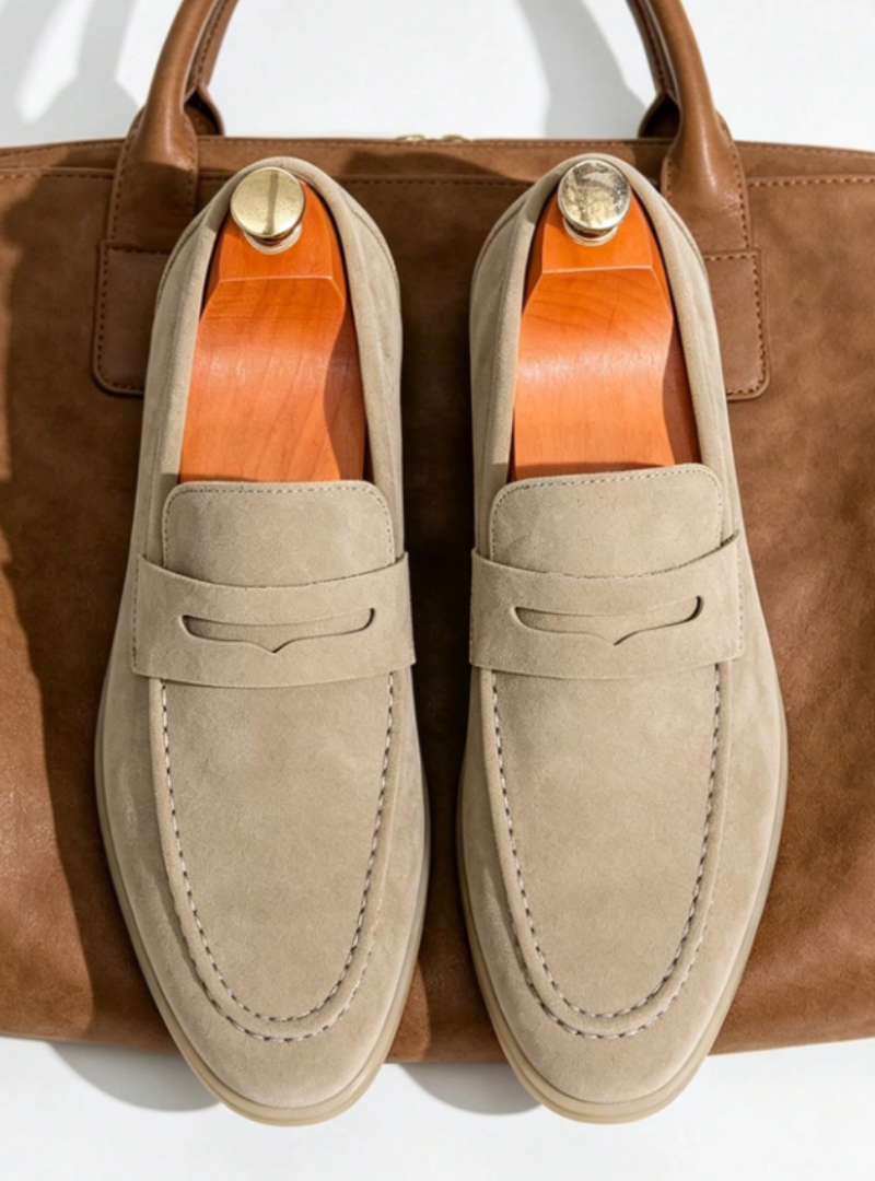 Men's plain penny loafers with moc toe stitching and low heels