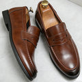 Men's penny loafers with slip-on design, almond toe and low heel