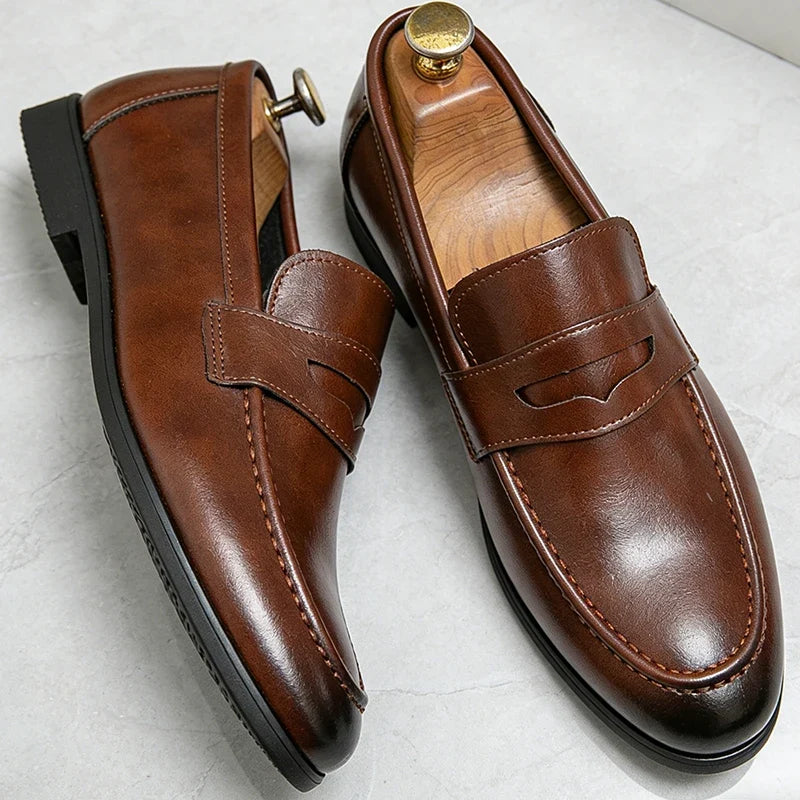 Men's penny loafers with slip-on design, almond toe and low heel