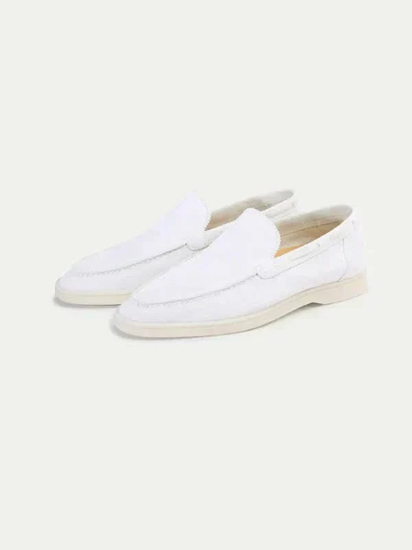 Men's white slip-on loafers with stitched detailing and flat soles