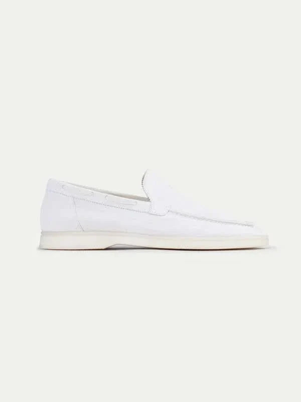 Men's white slip-on loafers with stitched detailing and flat soles
