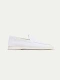 Men's white slip-on loafers with stitched detailing and flat soles