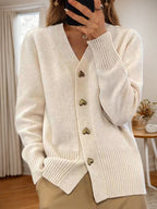 Women's V-neck cardigan with gold heart buttons, front pockets and ribbed trims