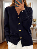 Women's V-neck cardigan with gold heart buttons, front pockets and ribbed trims