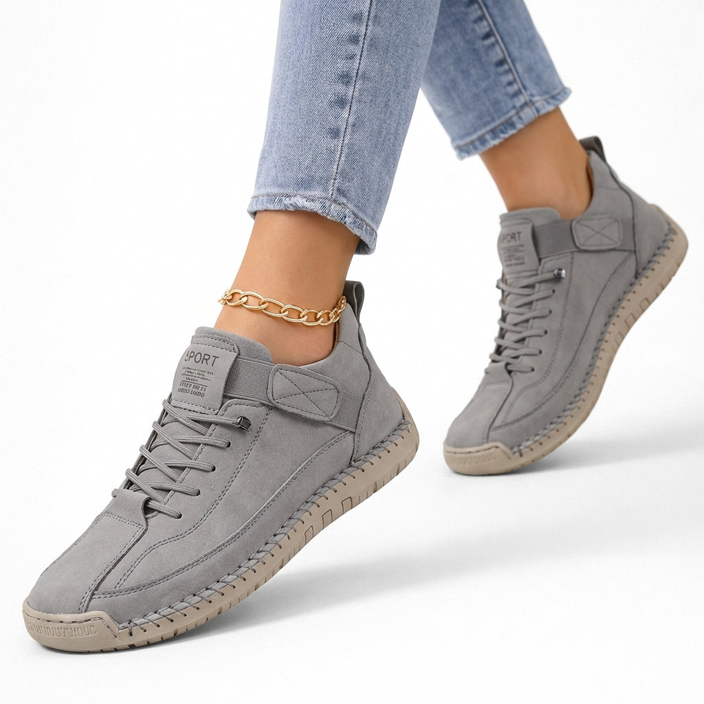 Low-top lace-up sneakers with round toes, side straps and flat textured soles