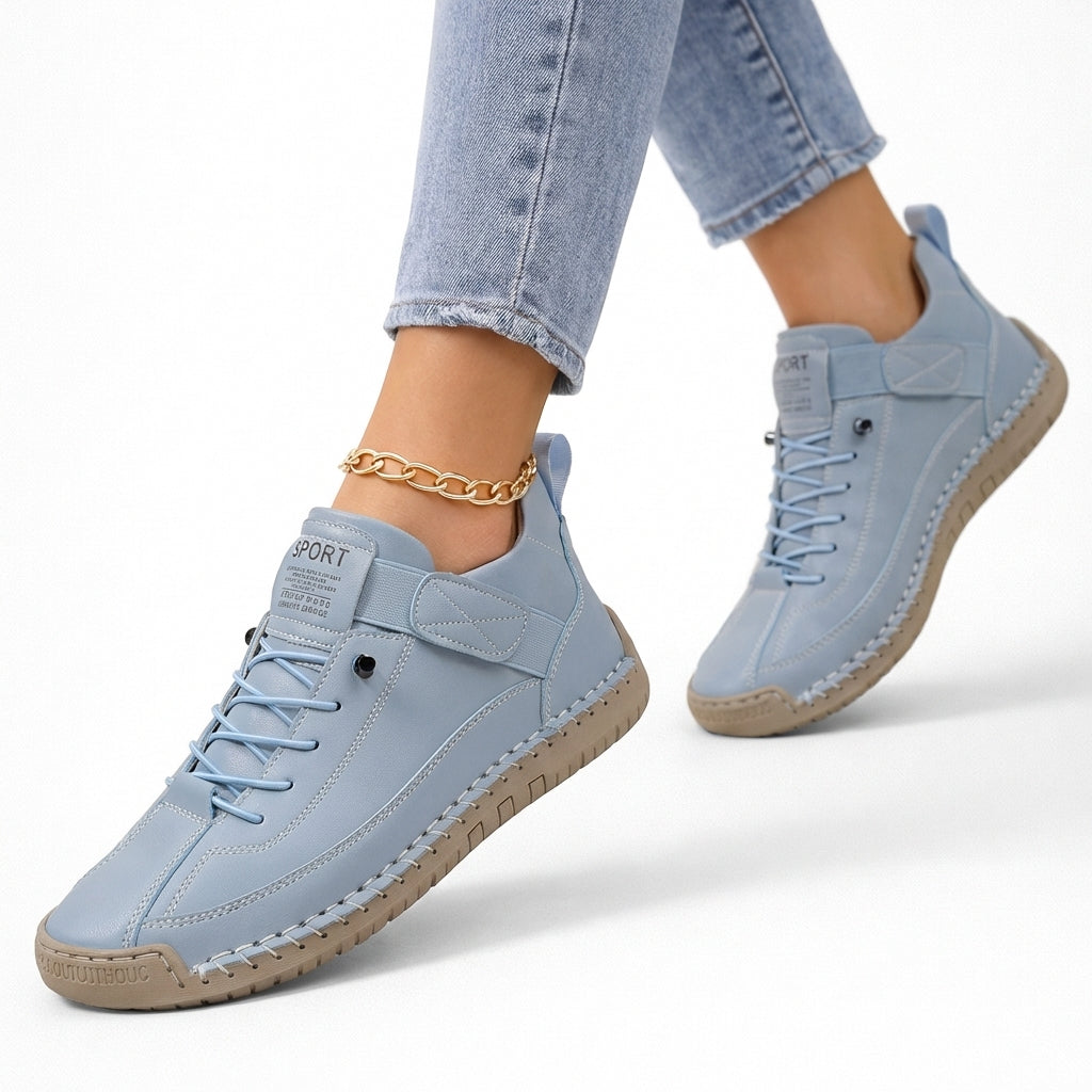 Low-top lace-up sneakers with round toes, side straps and flat textured soles