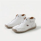 Ankle-height lace-up sneakers with stitched panels, ankle straps and contrast soles