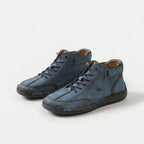Ankle-height lace-up sneakers with stitched panels, ankle straps and contrast soles