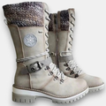 Women's mid-calf lace-up boots with buckle straps, side zips and chunky ridged soles