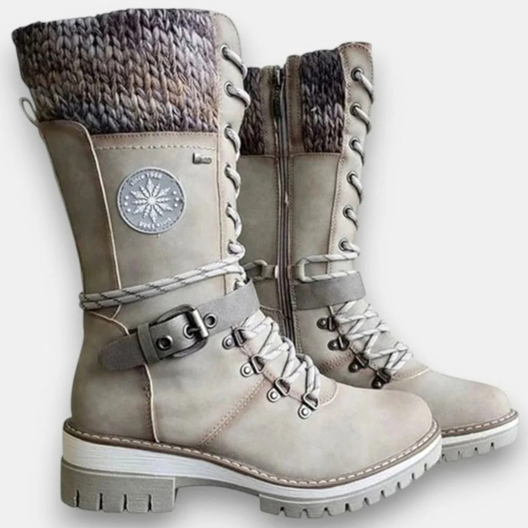 Women's mid-calf lace-up boots with buckle straps, side zips and chunky ridged soles