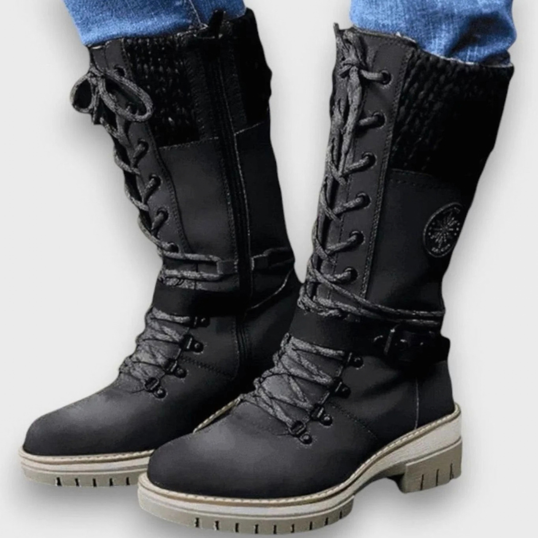 Women's mid-calf lace-up boots with buckle straps, side zips and chunky ridged soles