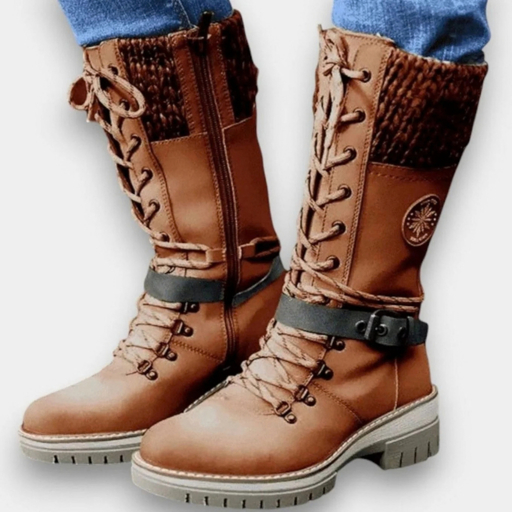 Women's mid-calf lace-up boots with buckle straps, side zips and chunky ridged soles