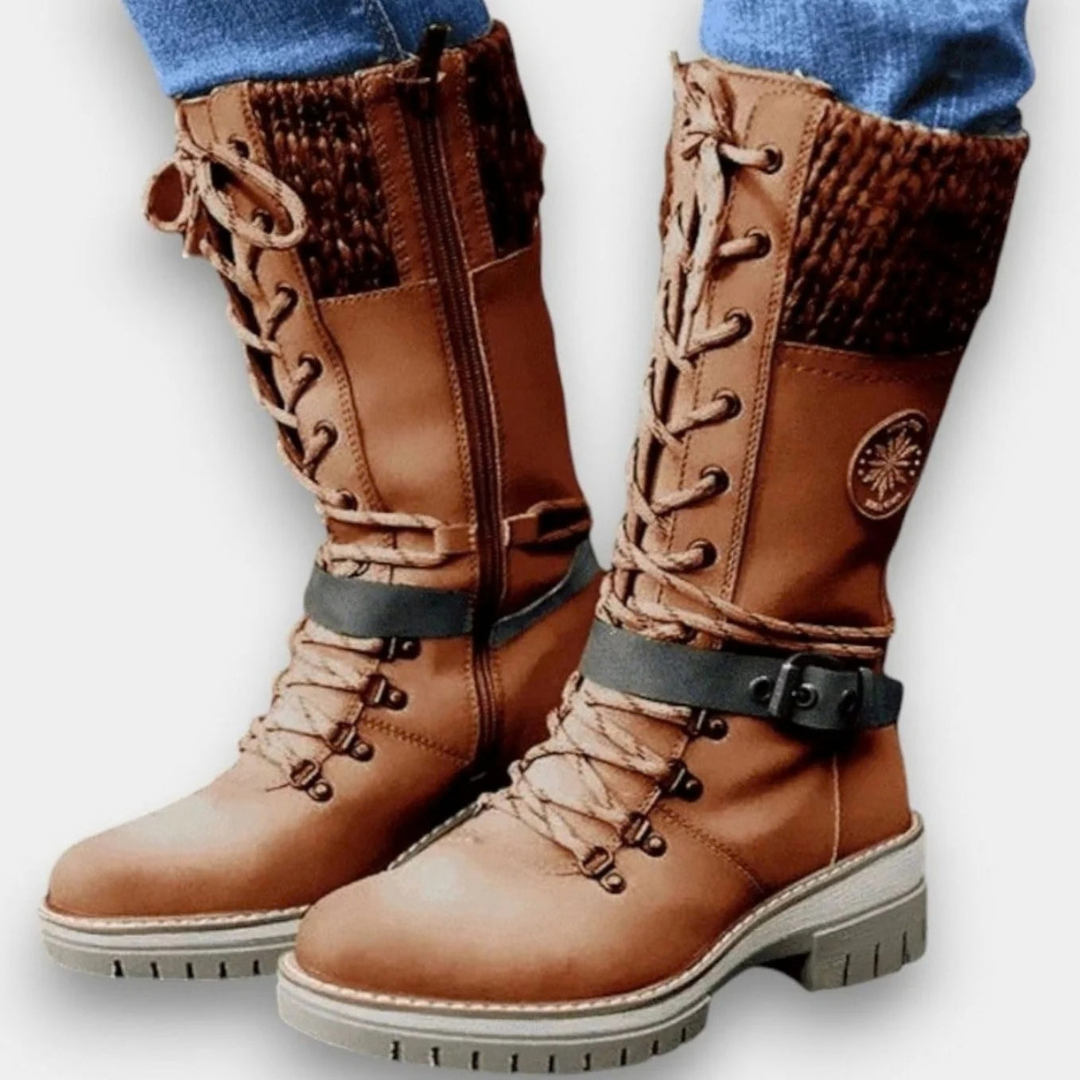 Women's mid-calf lace-up boots with buckle straps, side zips and chunky ridged soles